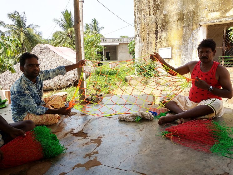 Man working on fish net