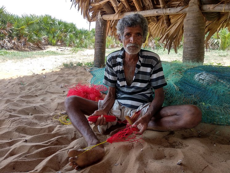 Man working on fish net