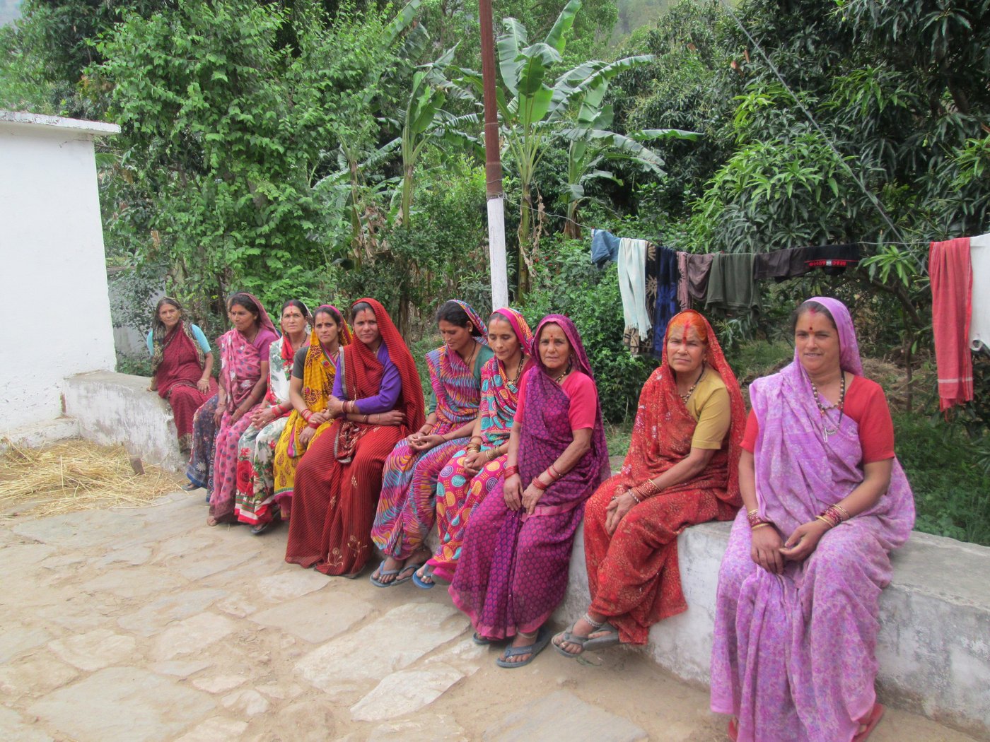 Group of women sitting on raised platform