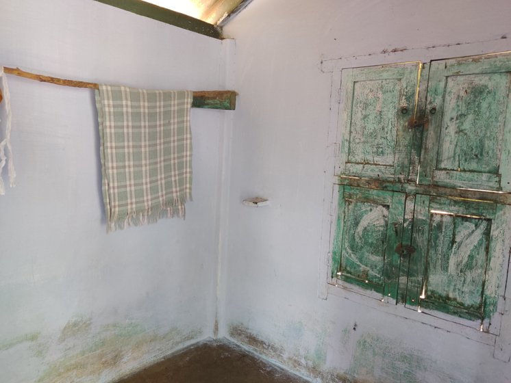 Left: Sacks containing vessels for the menstruating women are hung from the branches of a neem tree that stands between the two isolated rooms in Koovalapuram village. Food for the women is left in these sacks to avoid physical contact. Right: The smaller of the two rooms that are shared by the ‘polluted’ women