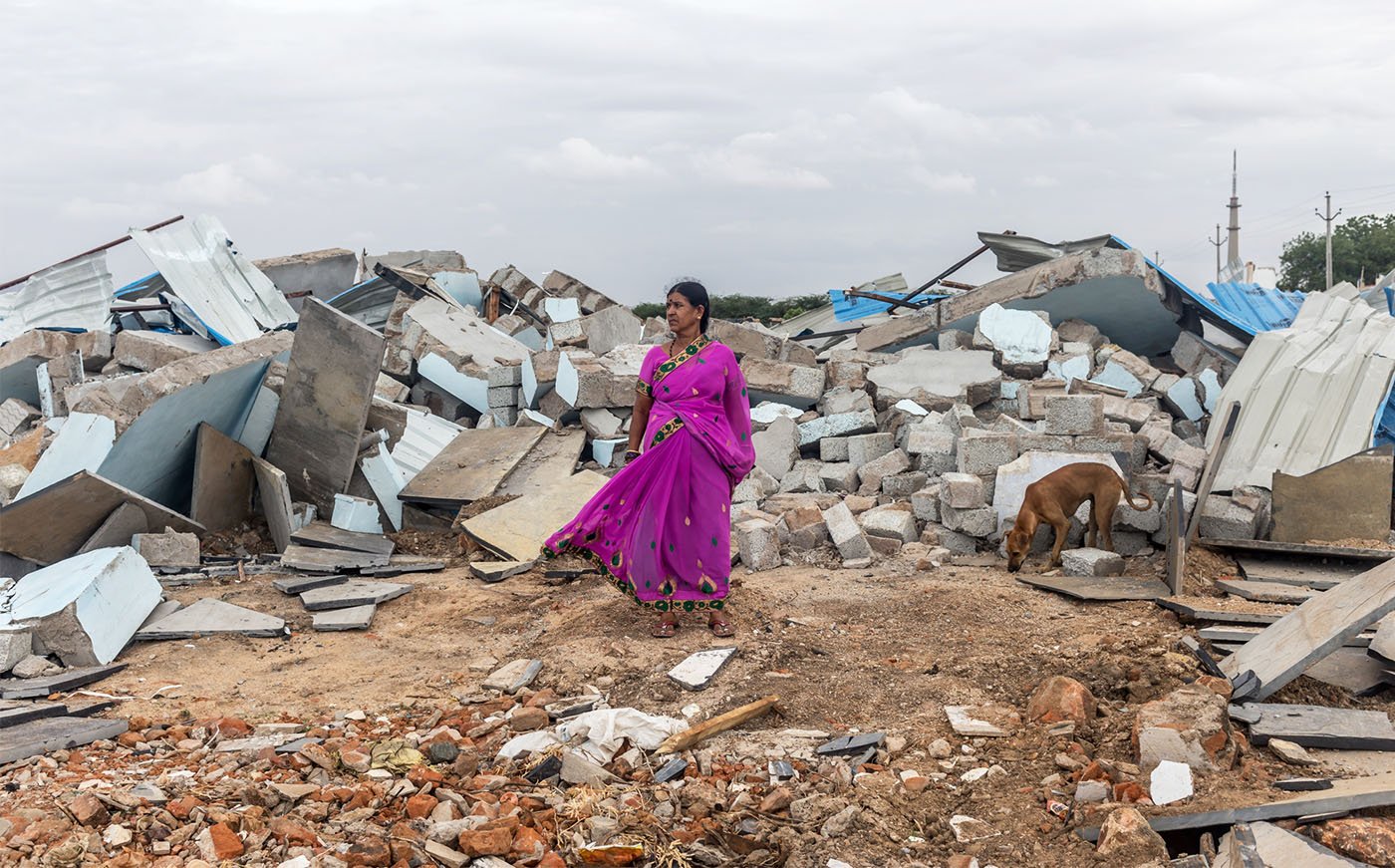 B. Ratnamma, next to her newly built home