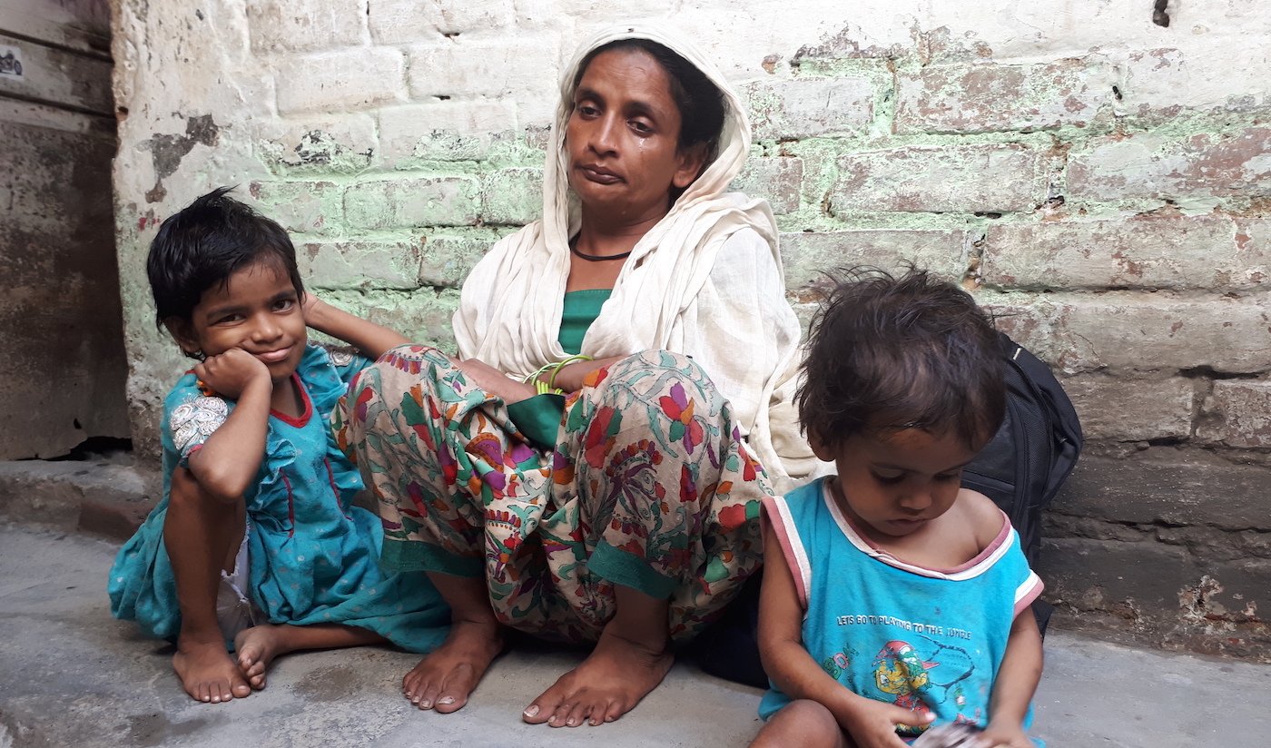 Rani visibly upset with her children by her side. 