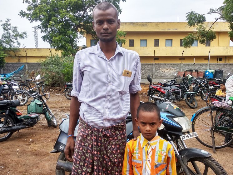 A worker with his son