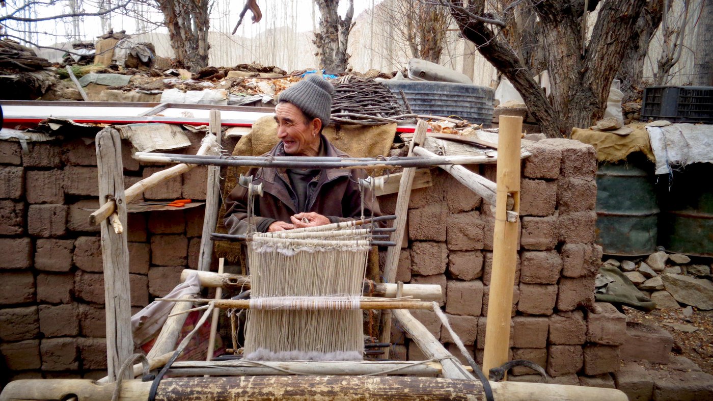 Tsering Angchuk from Leh weaves on his portable handloom