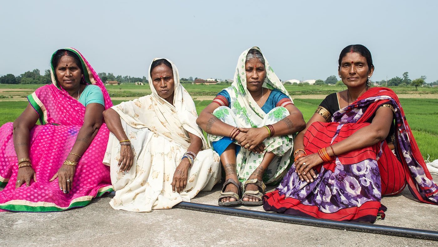 Women sitting in fiield