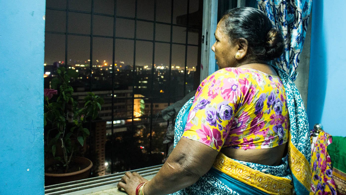 woman looking out of window