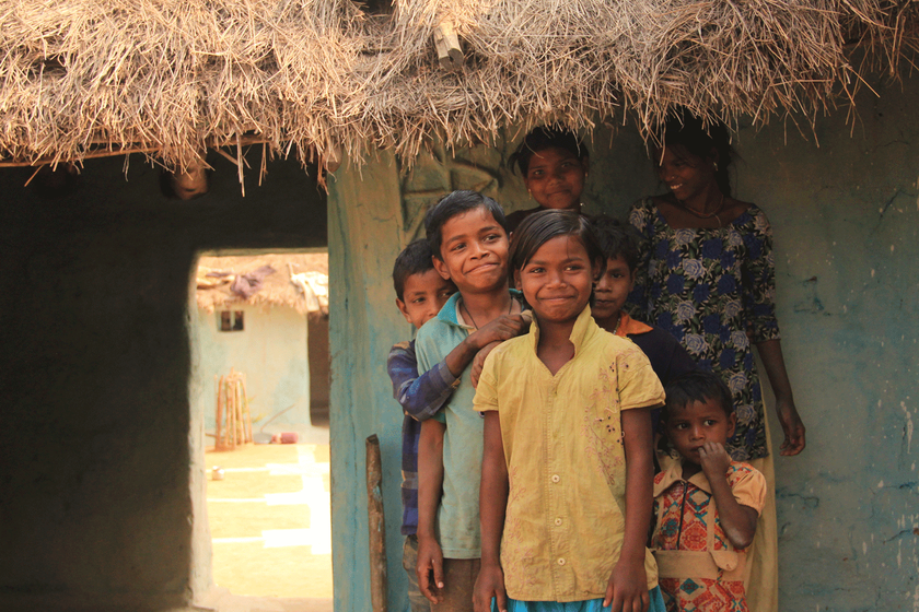 Kids in front of their house 