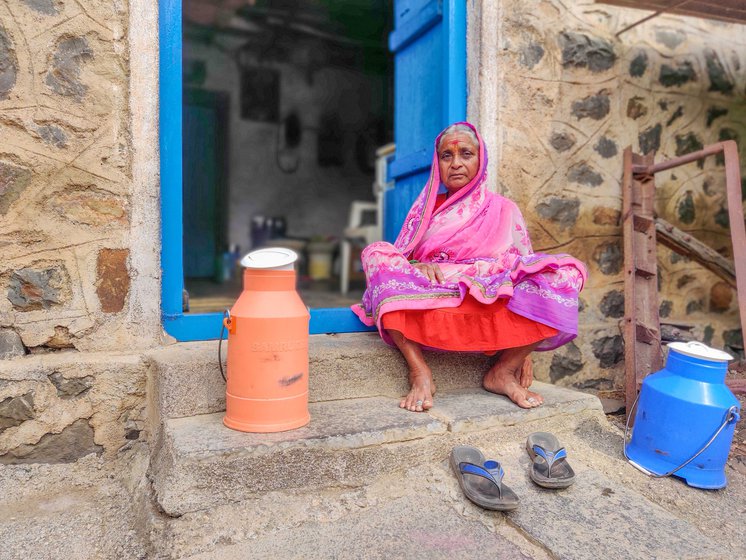 Arun's mother, Mangal , outside their hut