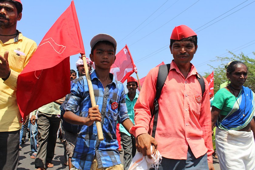 father and son at the farmers' rally