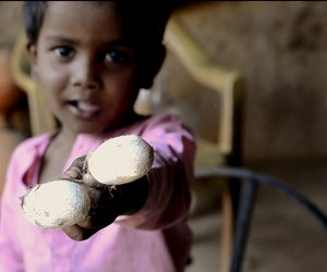 A child playing with cocoon