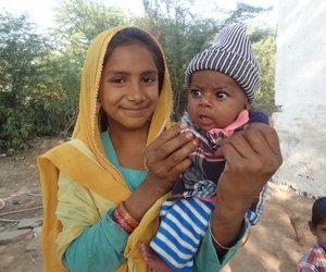 woman holding a cild