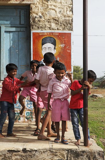 Young boys standing together outside school