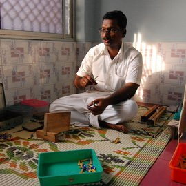 Man making Seevali, a handmade reed mouth-piece to play the Nadaswaram