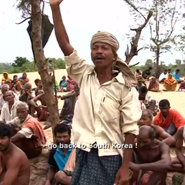 Man singing amongst group of people