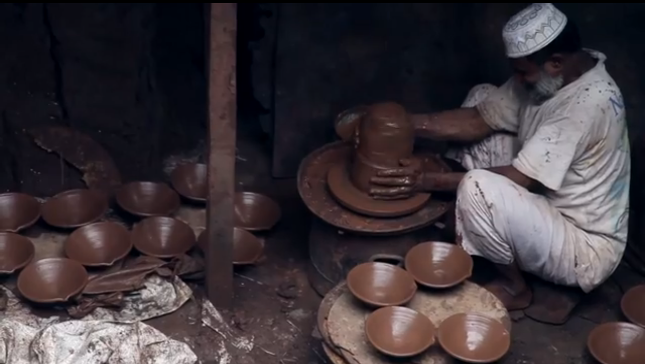 Muslim Man making clay pots